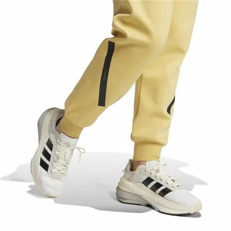 Ilgos sportinės kelnės Adidas Z.N.E. Geltona Moteris
